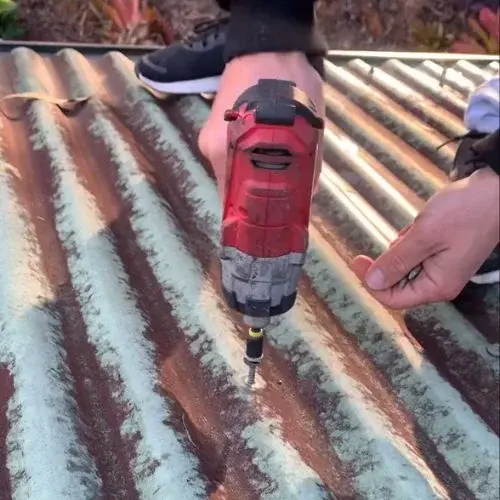 Drilling a rusted corrugated metal panel