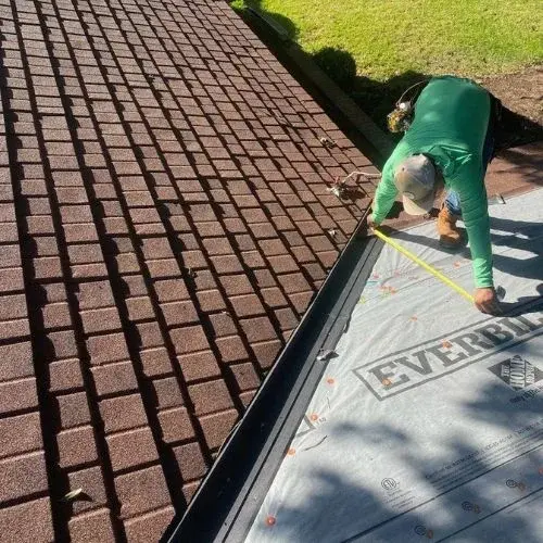 A professional measuring a roof